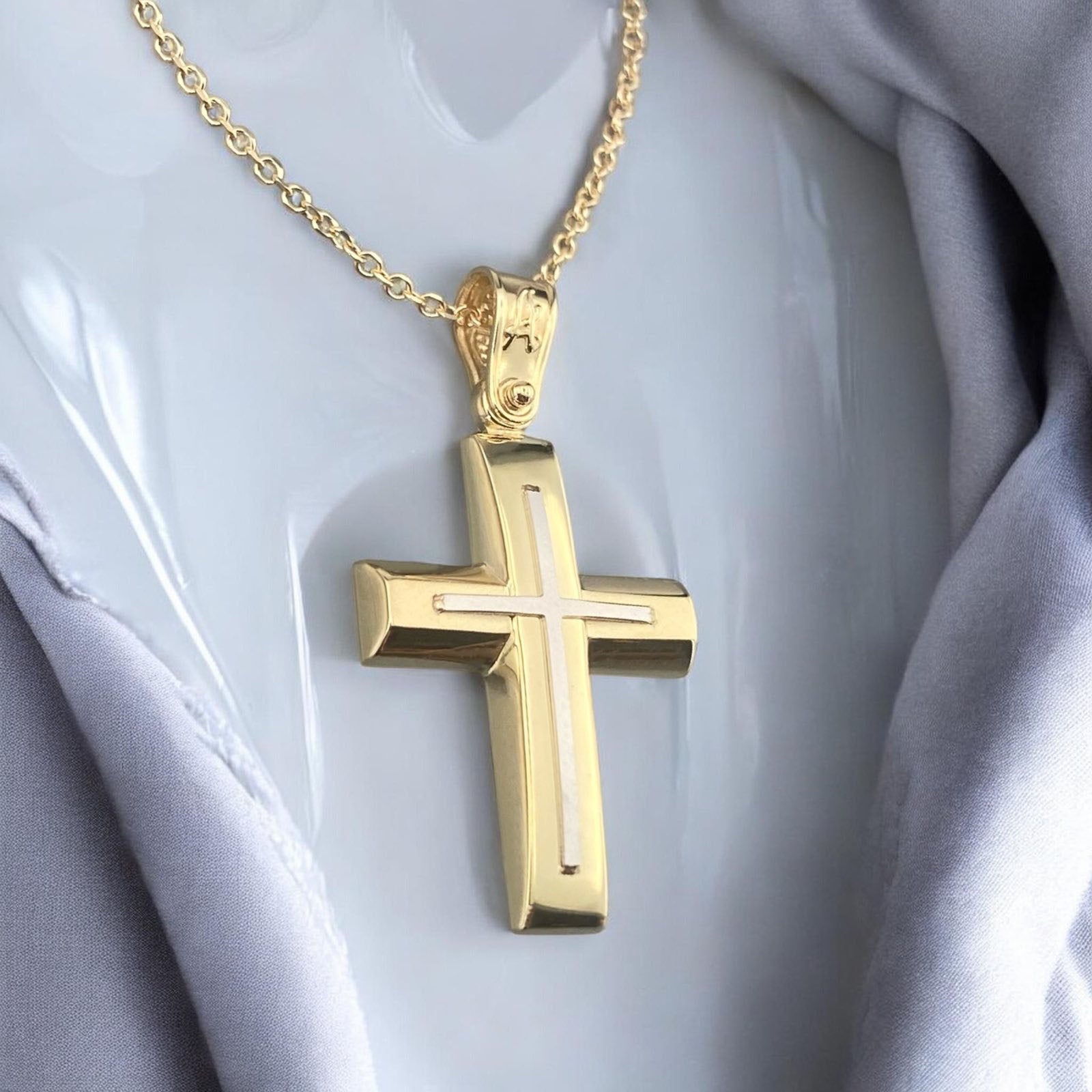 A 14K gold men's cross pendant featuring a unique design with a matte horizontal bar and a polished vertical bar.