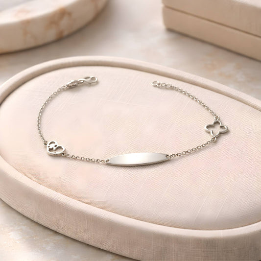 Children's 14k white gold ID bracelet featuring a clover charm and a heart charm with star cut-outs by Glamour Dainty Jewels, delicate baby jewelry.