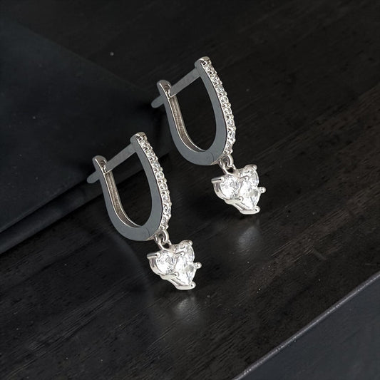 Elegant 14k white gold drop earrings featuring a sparkling cluster of cubic zirconia, accented by a zirconia-paved hoop mechanism.