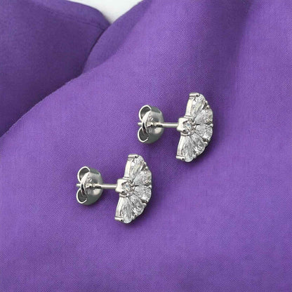 Elegant 14k white gold stud earrings featuring a fan-shaped design with sparkling baguette and round crystals.