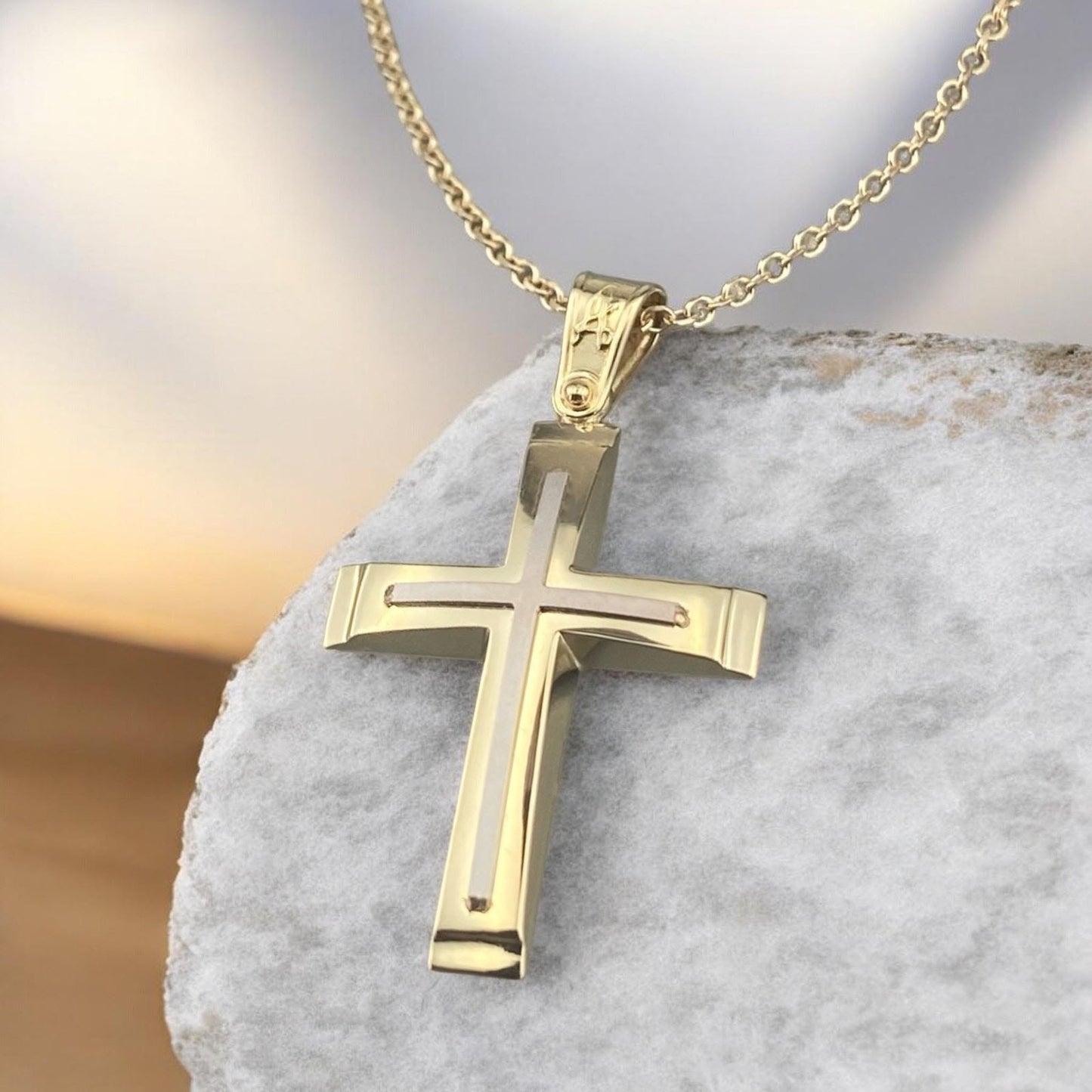 A 14K yellow and white gold men's cross pendant featuring a polished inlay cross design.