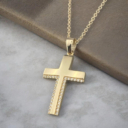 14k yellow gold cross pendant for women, featuring a sophisticated design with two parallel rows of sparkling zirconia stones
