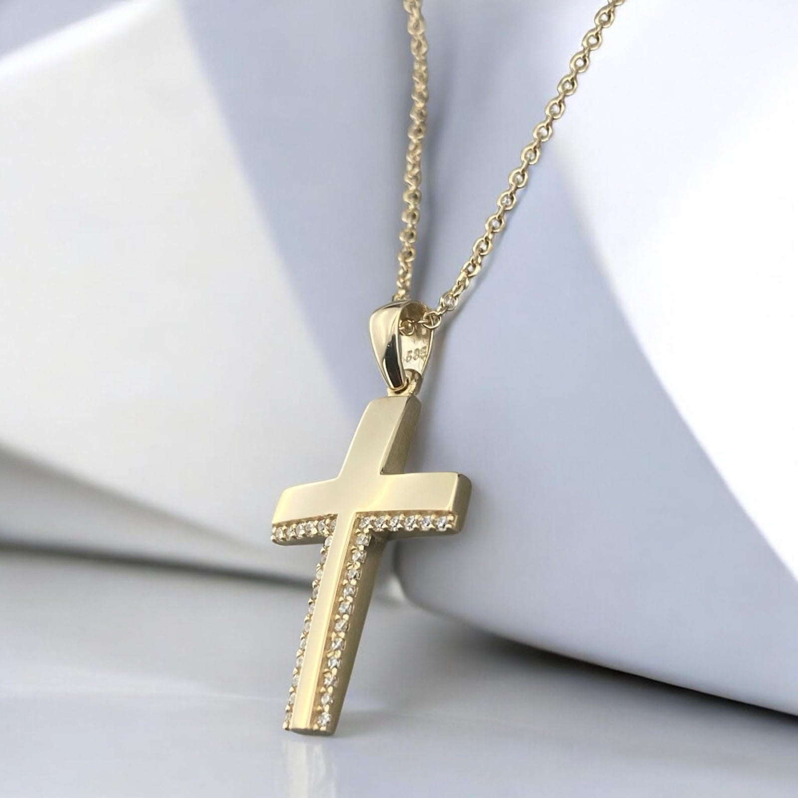 14k yellow gold cross pendant for women, featuring a sophisticated design with two parallel rows of sparkling zirconia stones