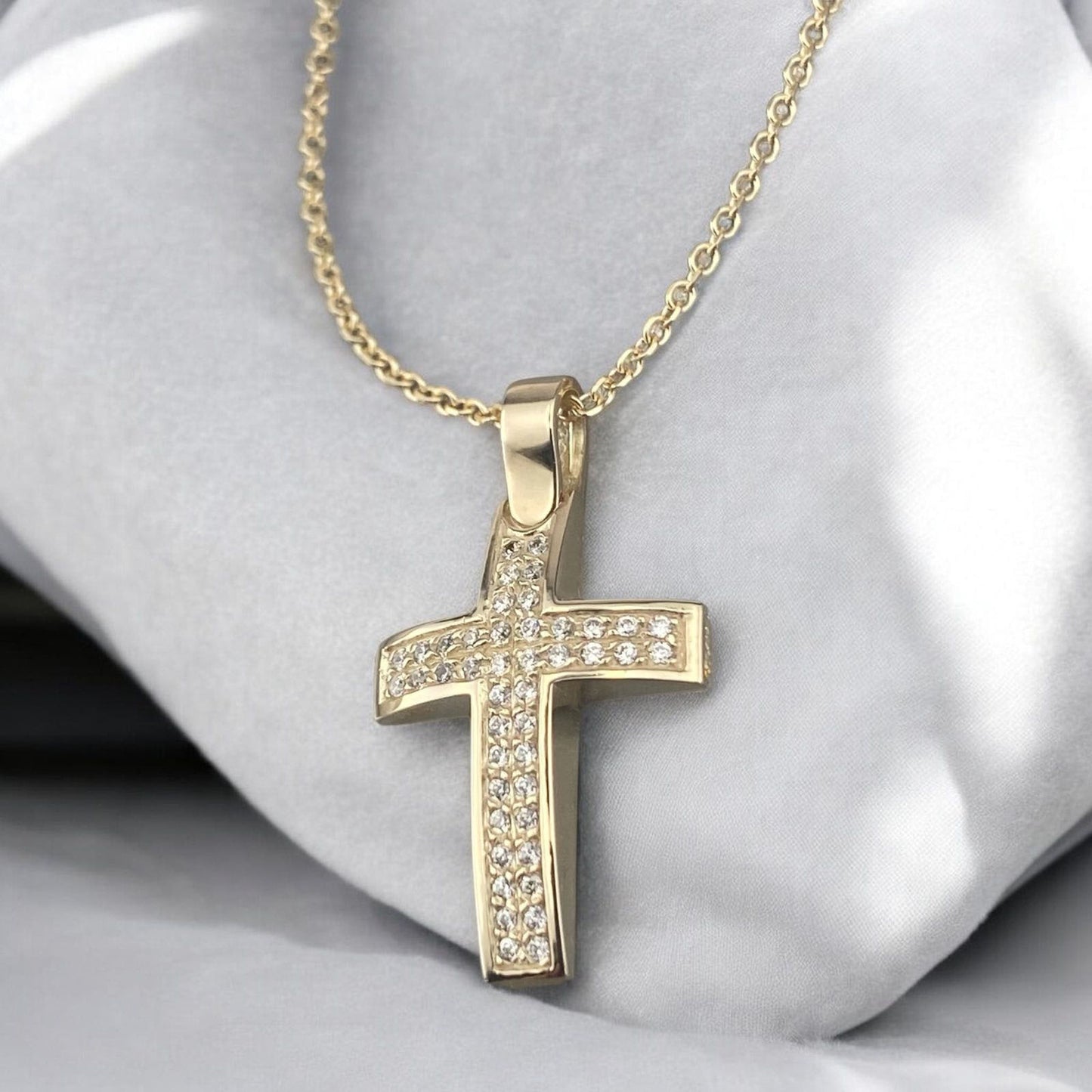 14k yellow gold cross pendant for women, featuring two parallel rows of brilliant zirconia stones.