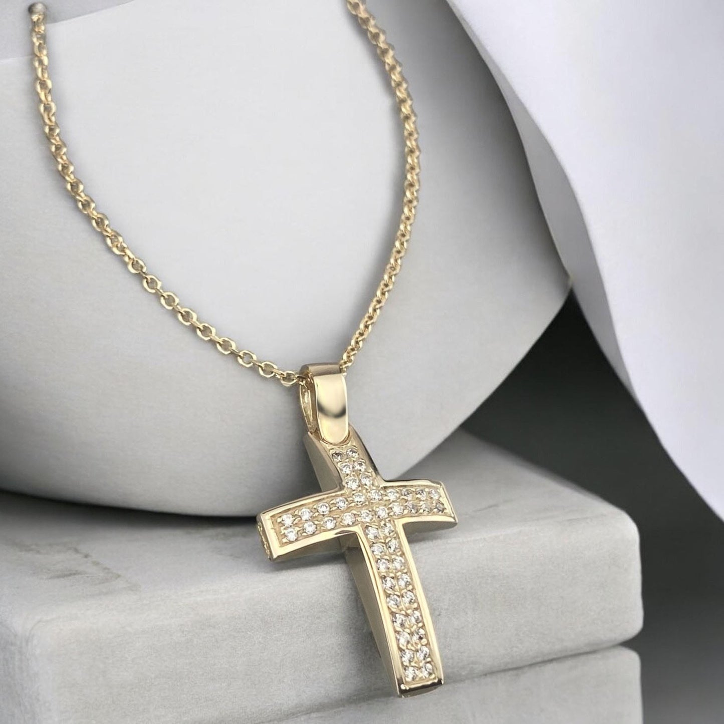 14k yellow gold cross pendant for women, featuring two parallel rows of brilliant zirconia stones.