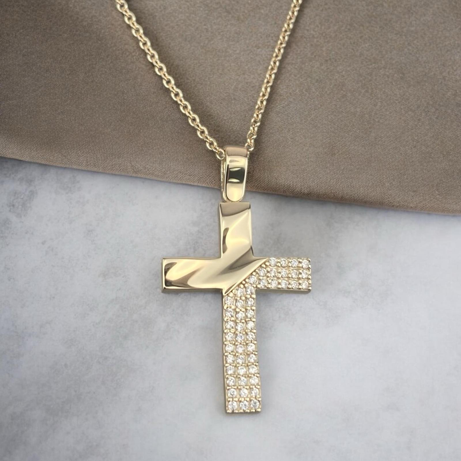 14k yellow gold cross pendant for women, featuring a luxurious paved design with sparkling zirconia stones.