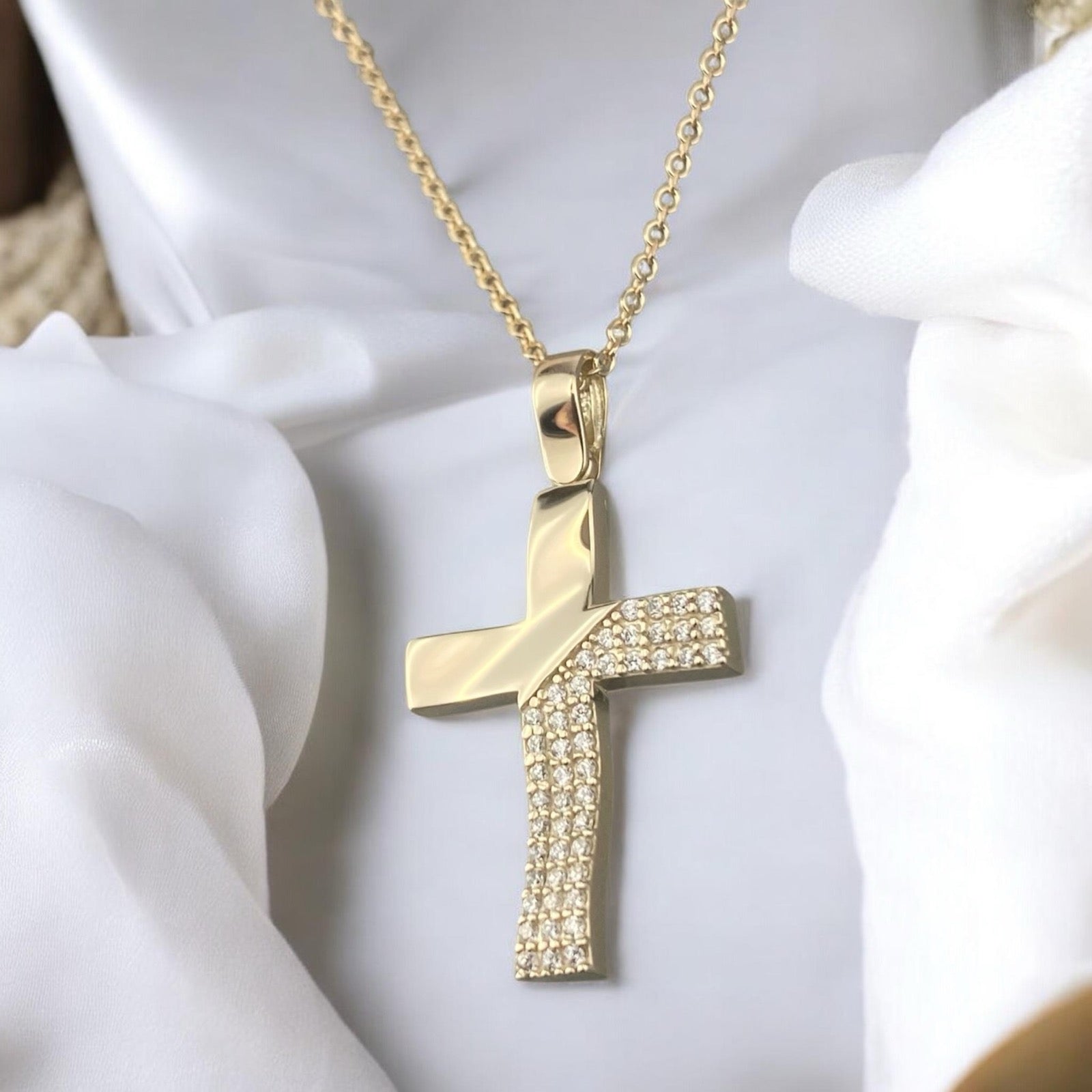 14k yellow gold cross pendant for women, featuring a luxurious paved design with sparkling zirconia stones.