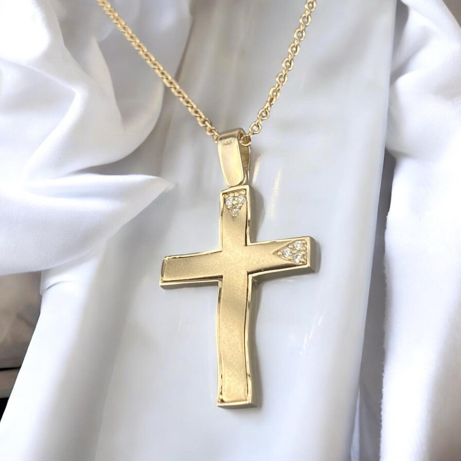 14k yellow gold cross pendant for women, featuring a minimalist design with elegant triangular zirconia stone accents.