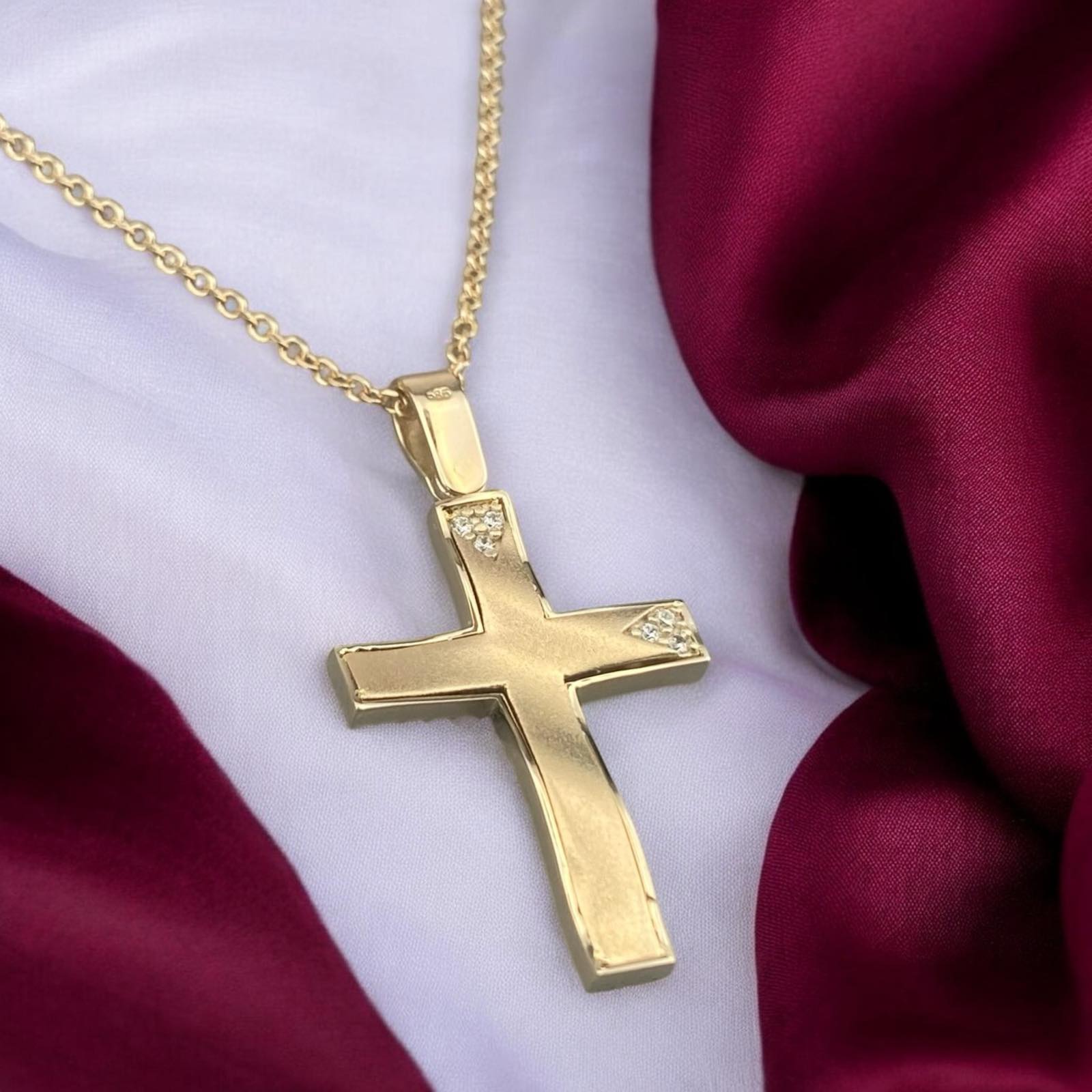 14k yellow gold cross pendant for women, featuring a minimalist design with elegant triangular zirconia stone accents.