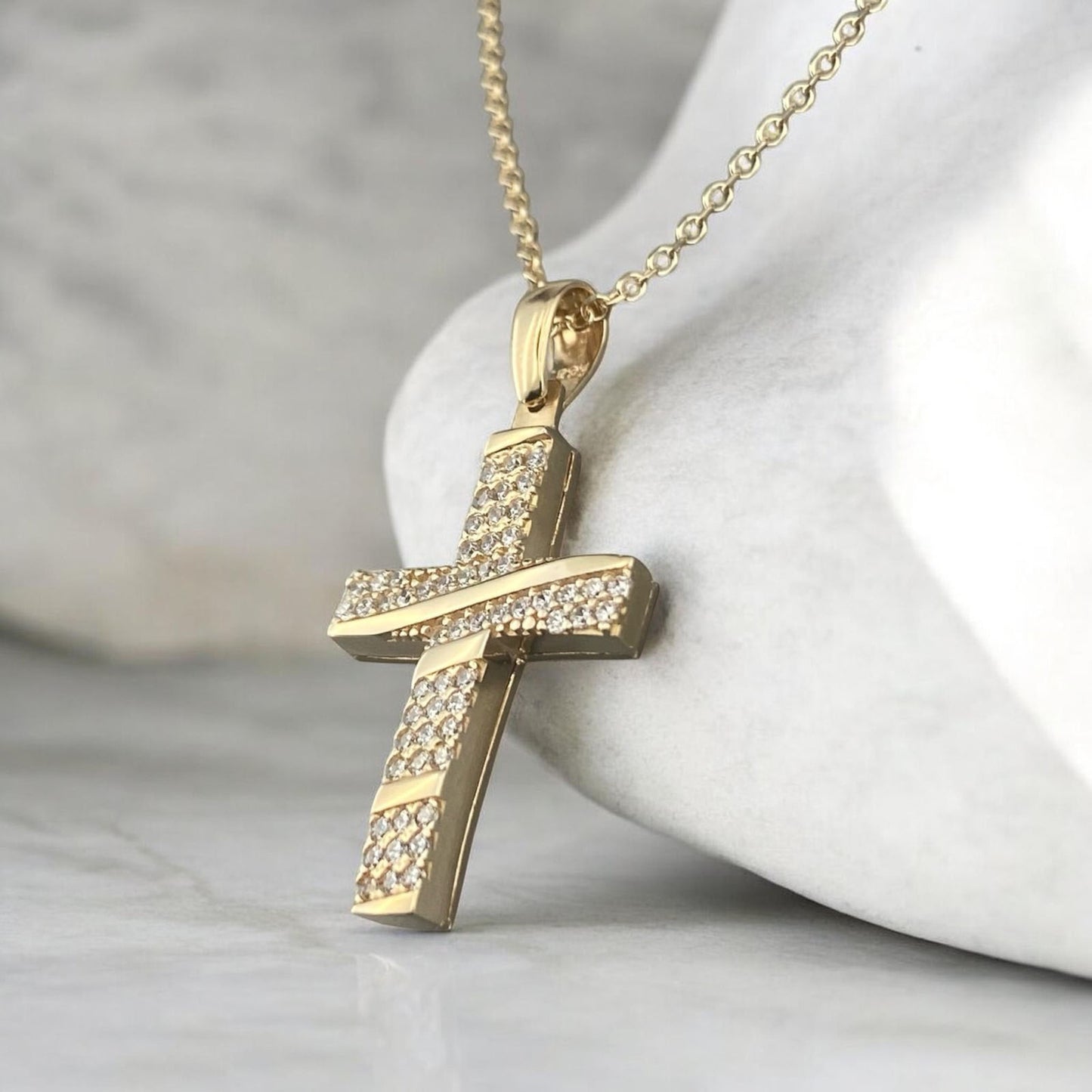 4k yellow gold cross pendant for women, featuring a refined central row of sparkling zirconia stones.