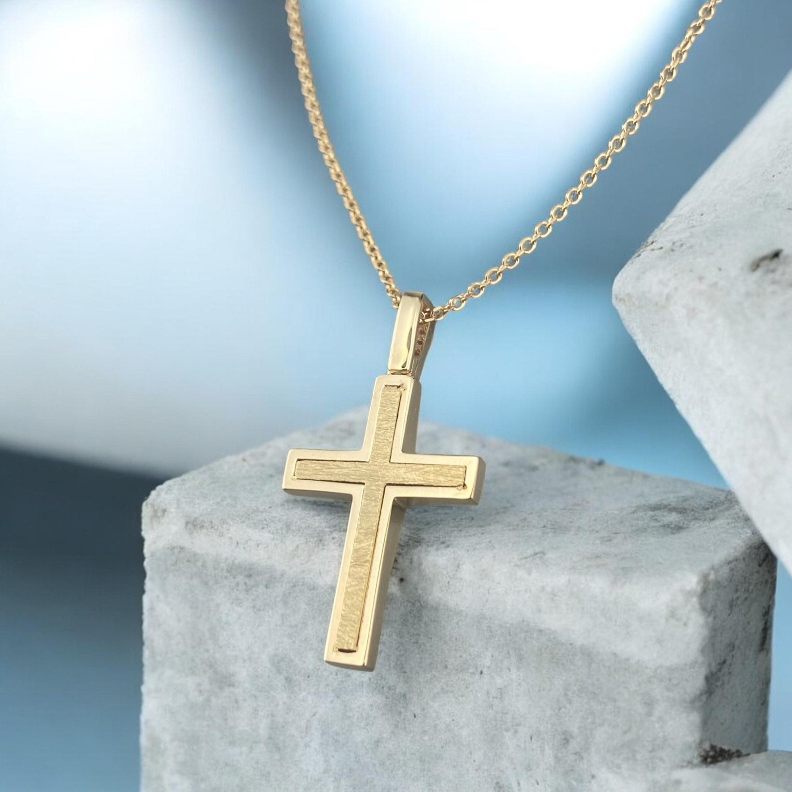 14k yellow gold cross pendant for women, featuring a modern design with sparkling zirconia stones.