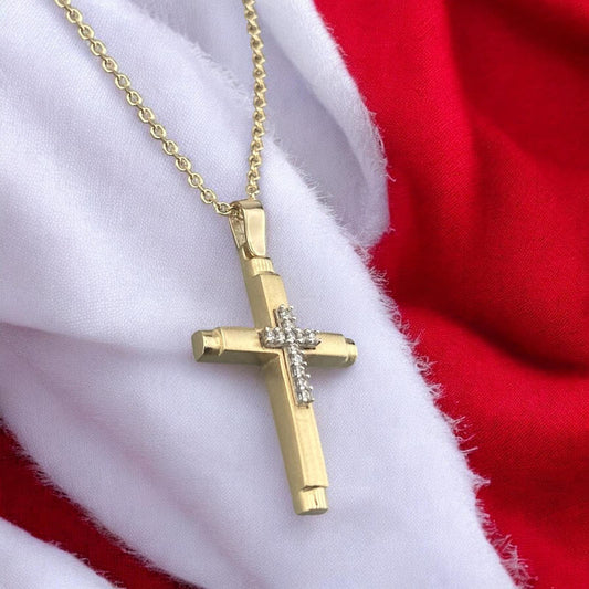 14k yellow gold women's cross pendant, featuring a sleek polished design with a central vertical row of brilliant zirconia stones.