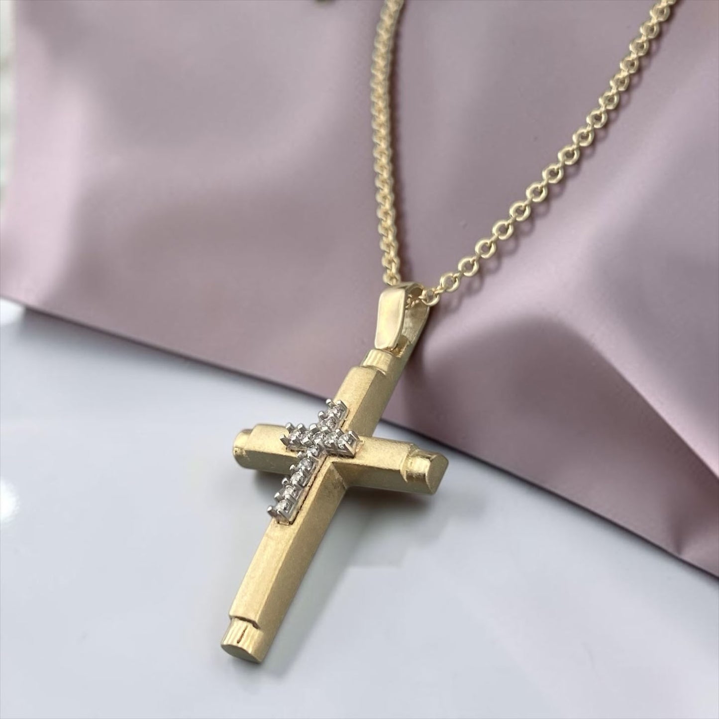 14k yellow gold women's cross pendant, featuring a sleek polished design with a central vertical row of brilliant zirconia stones.