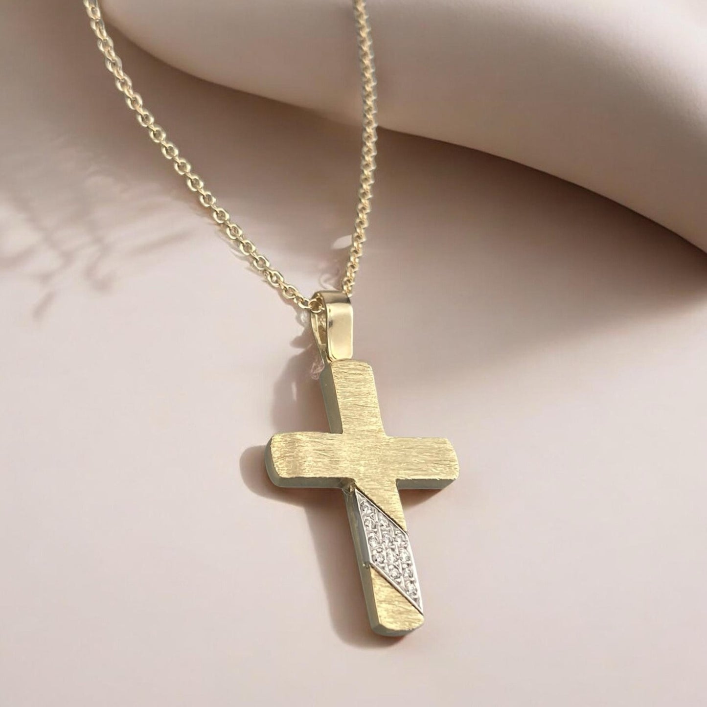 14k yellow gold cross pendant for women, featuring a unique brushed texture and sparkling zirconia stones.