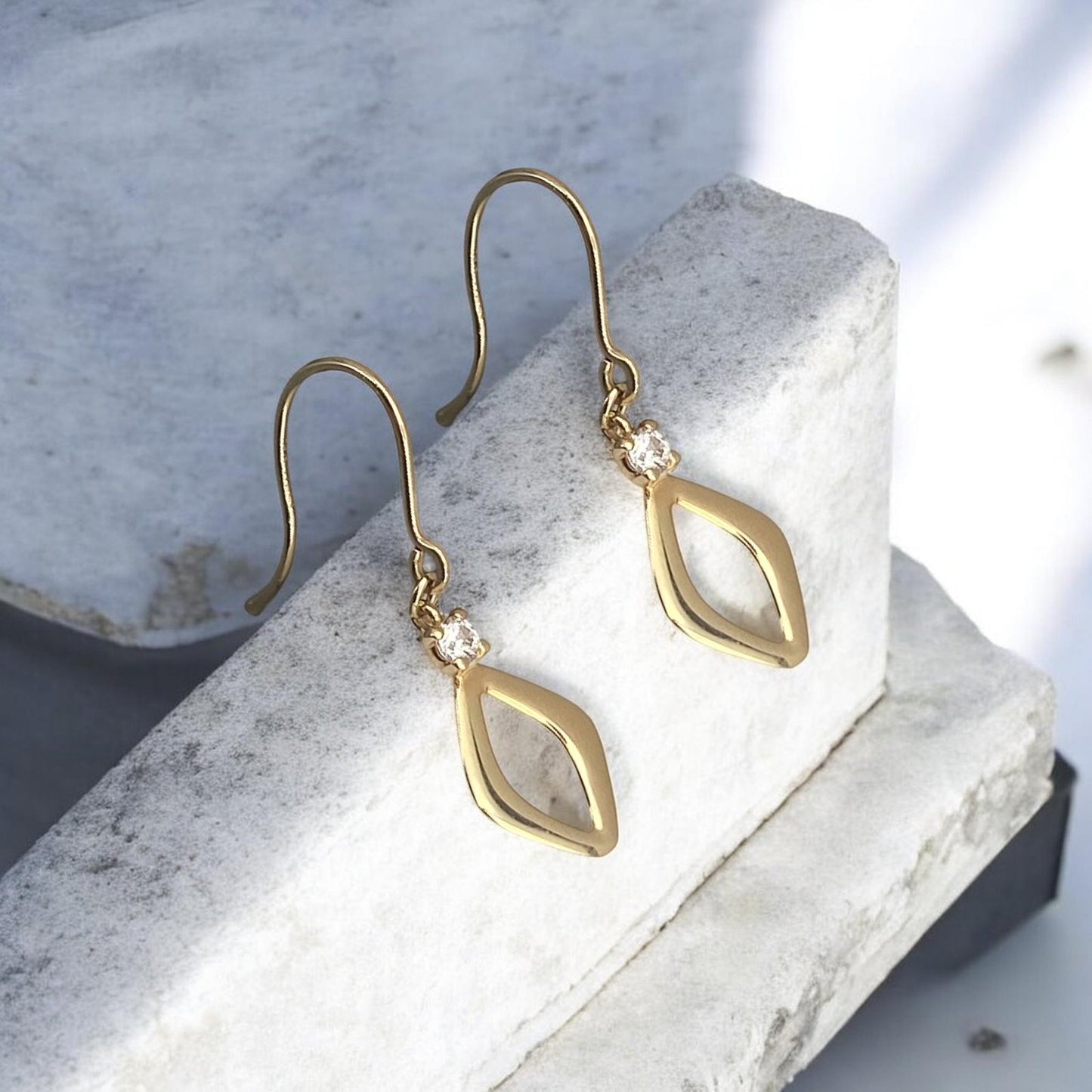 14k yellow gold geometric drop earrings featuring a rhombus design with a sparkling cubic zirconia stone.