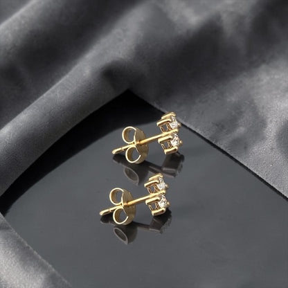 Minimalist 14k yellow gold stud earrings featuring two sparkling lab-grown diamonds in a sophisticated tiered setting.