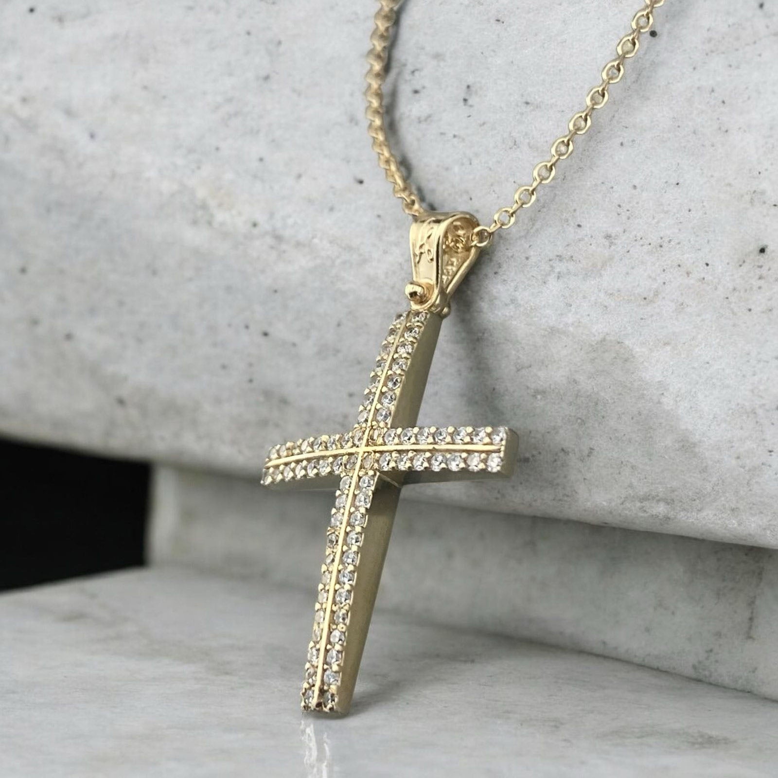 14K yellow gold cross pendant featuring double rows of white zirconia stones and a polished finish