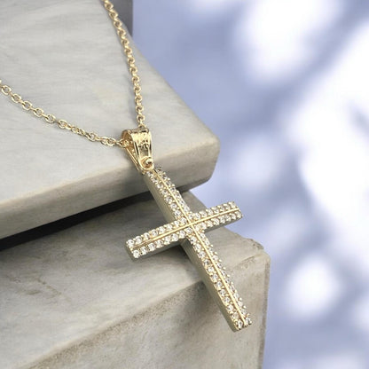 14K yellow gold cross pendant featuring double rows of white zirconia stones and a polished finish