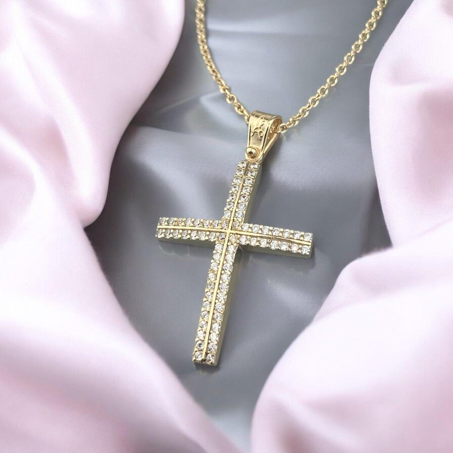 14K yellow gold cross pendant featuring double rows of white zirconia stones and a polished finish