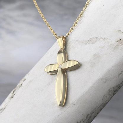 14k yellow gold cross pendant for women, featuring a unique floral-inspired petal design with a central sparkling zirconia stone.
