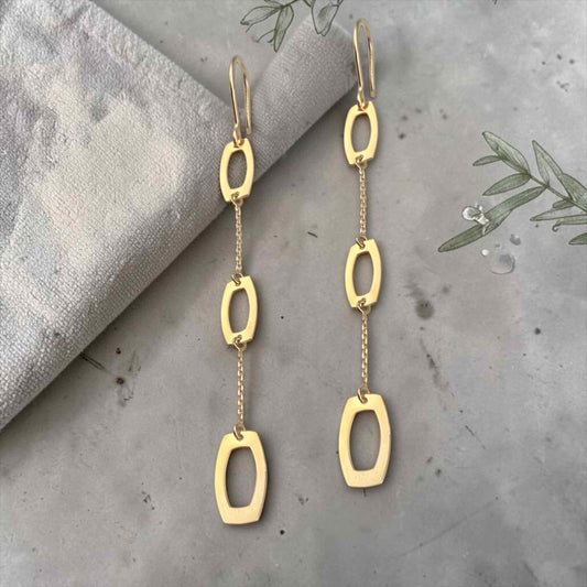 Modern 14k yellow gold chain drop earrings featuring elongated geometric open links with a polished finish.