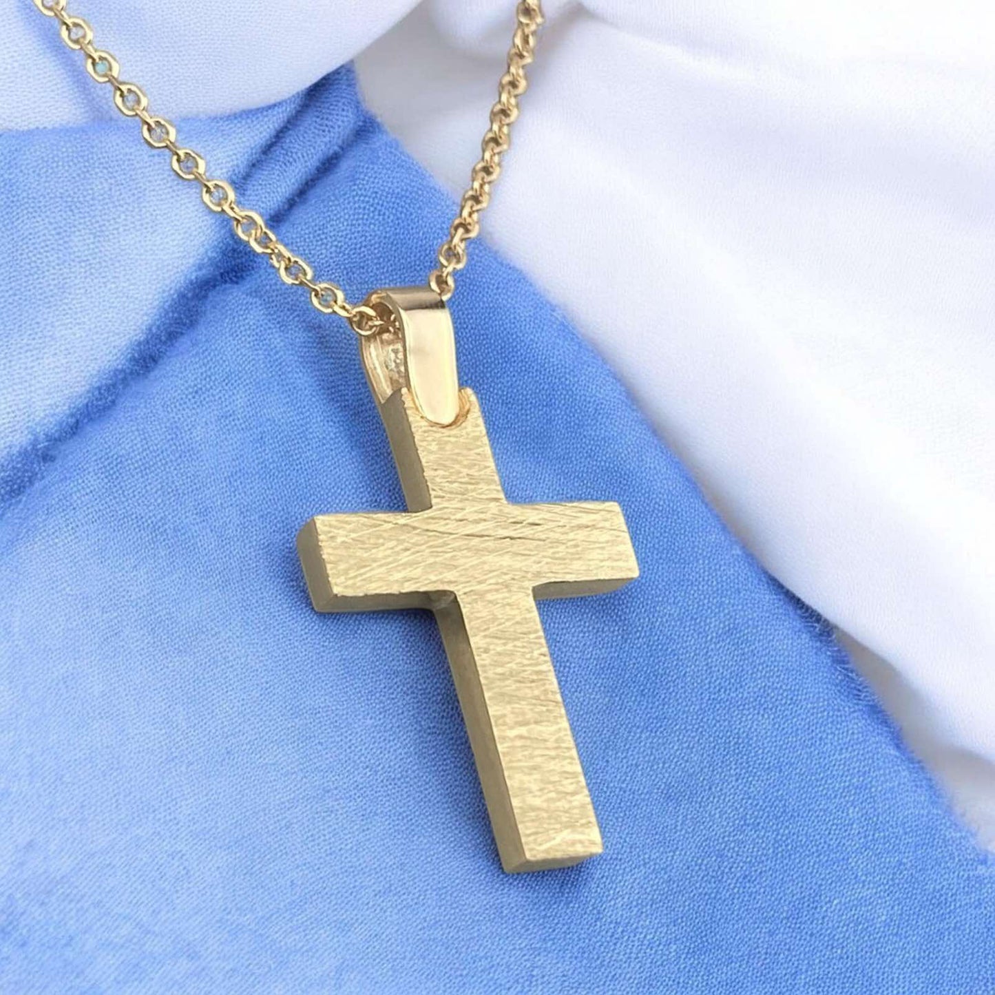 A 14K yellow gold men's cross pendant featuring a distinctive brushed matte finish design.