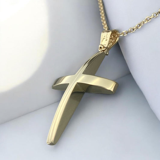 A 14K yellow gold men's cross pendant featuring a unique and elegant center design detail.
