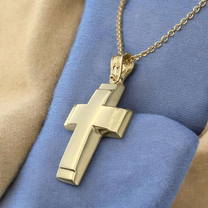 A 14K yellow gold men's cross pendant featuring a polished finish and distinct detailed edges.