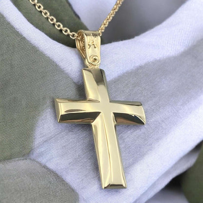 A 14K yellow gold men's cross pendant featuring a smooth, high-shine polished surface.