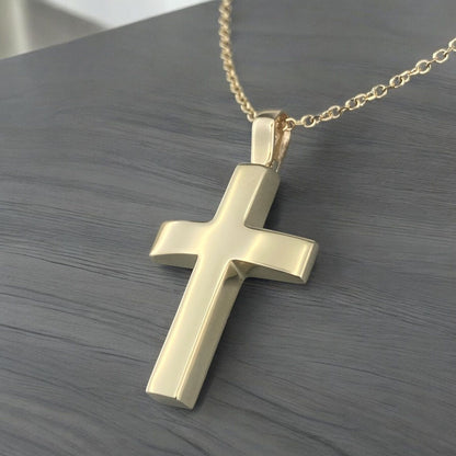 A 14K yellow gold men's cross pendant featuring a smooth, high-shine polished finish.
