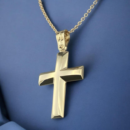 A 14K yellow gold men's cross pendant featuring a smooth, high-shine polished surface.