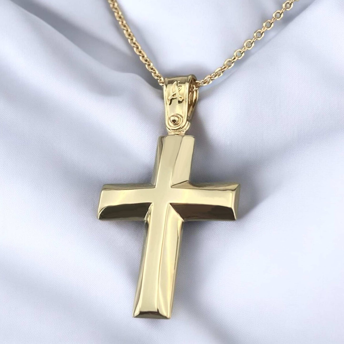 A 14K yellow gold men's cross pendant featuring a smooth, high-shine polished surface.