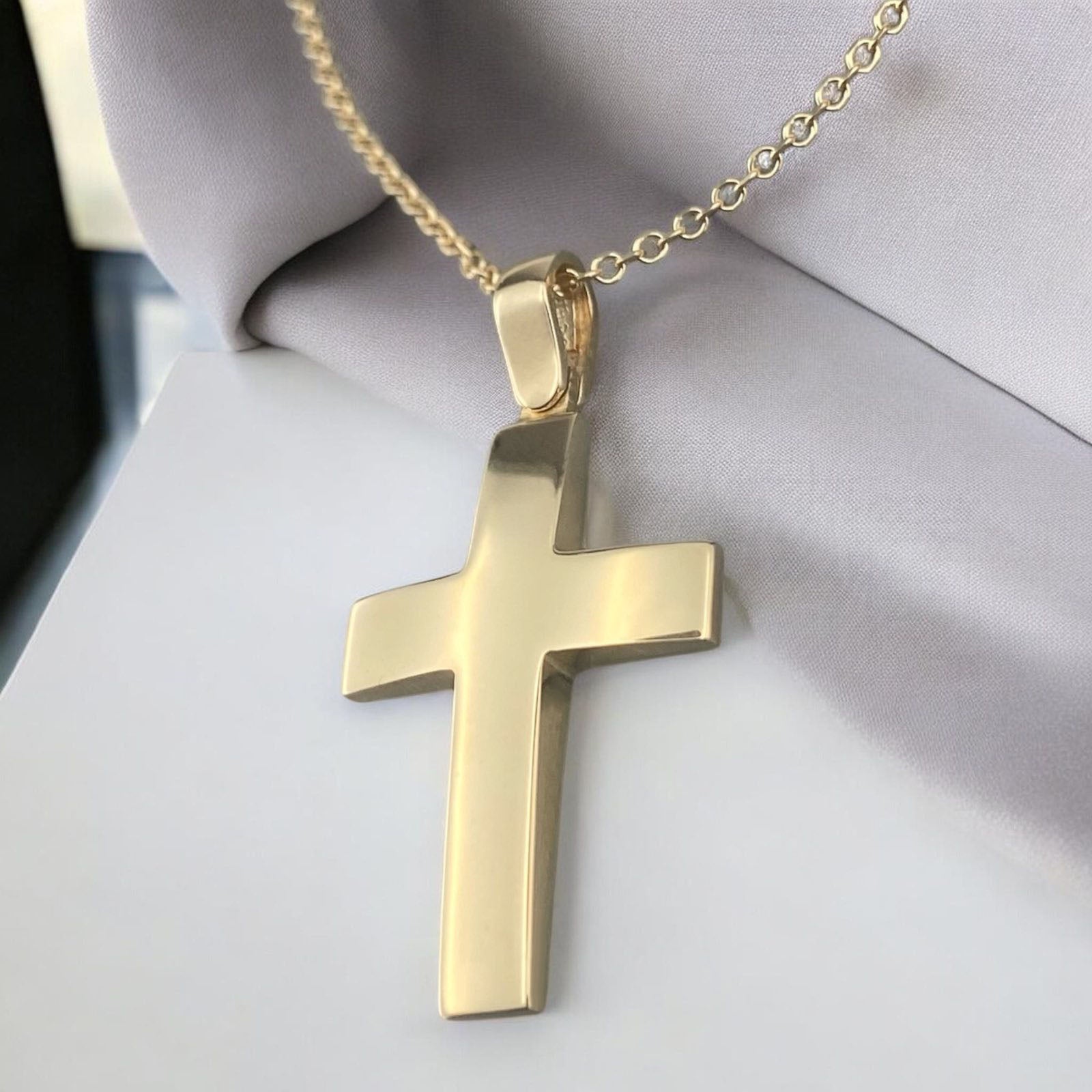 A 14K yellow gold men's cross pendant featuring a smooth, polished high-shine surface.