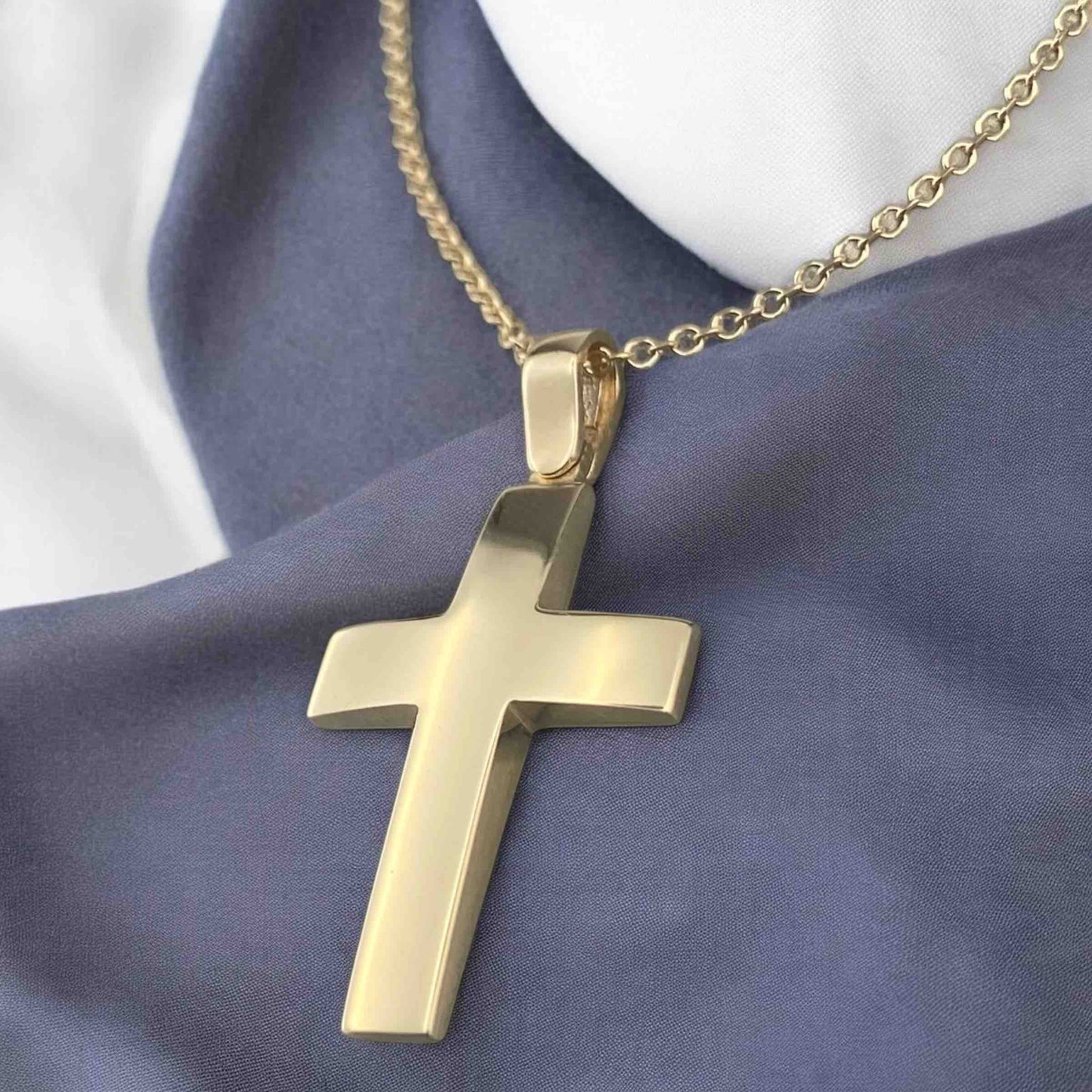 A 14K yellow gold men's cross pendant featuring a smooth, polished high-shine surface.