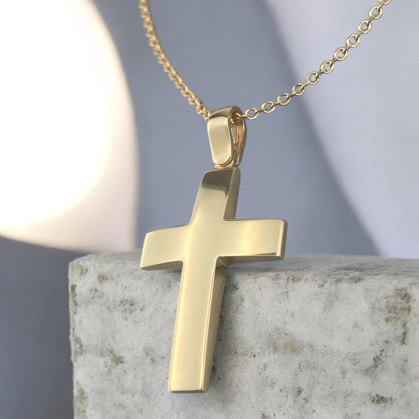 A 14K yellow gold men's cross pendant featuring a smooth, polished high-shine surface.
