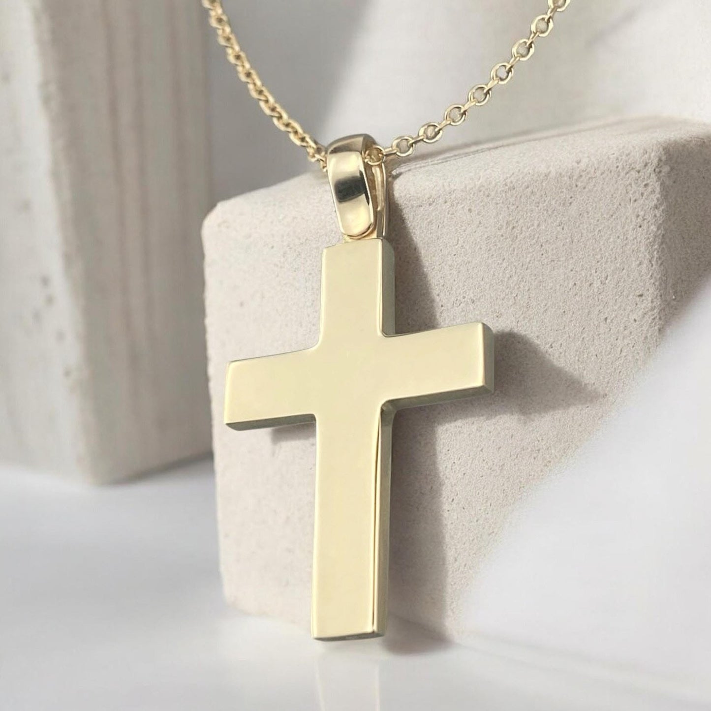 A 14K yellow gold men's cross pendant with a clean, polished high-shine finish.