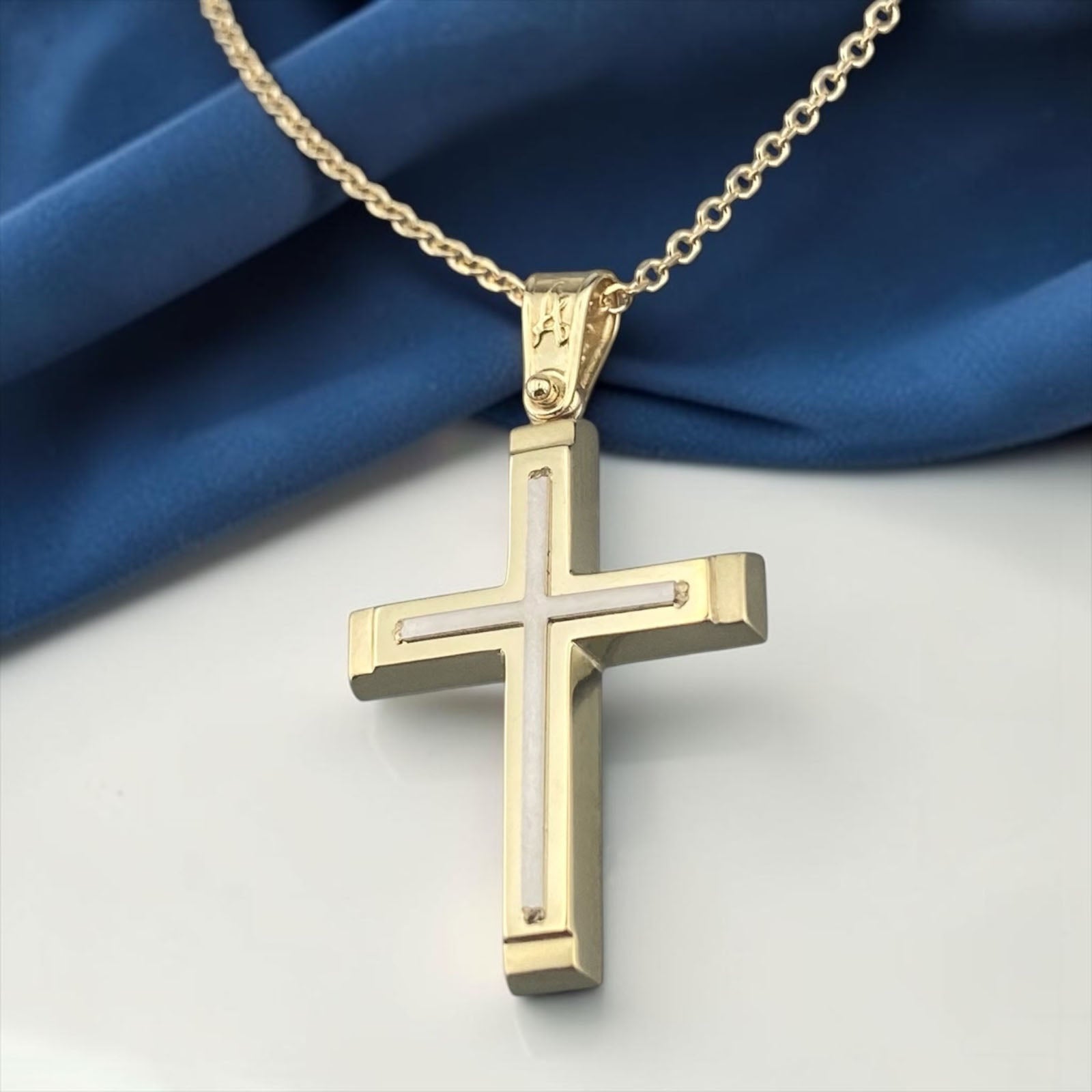 A 14K yellow gold men's cross pendant featuring a detailed white gold cross inlay centered in the design.
