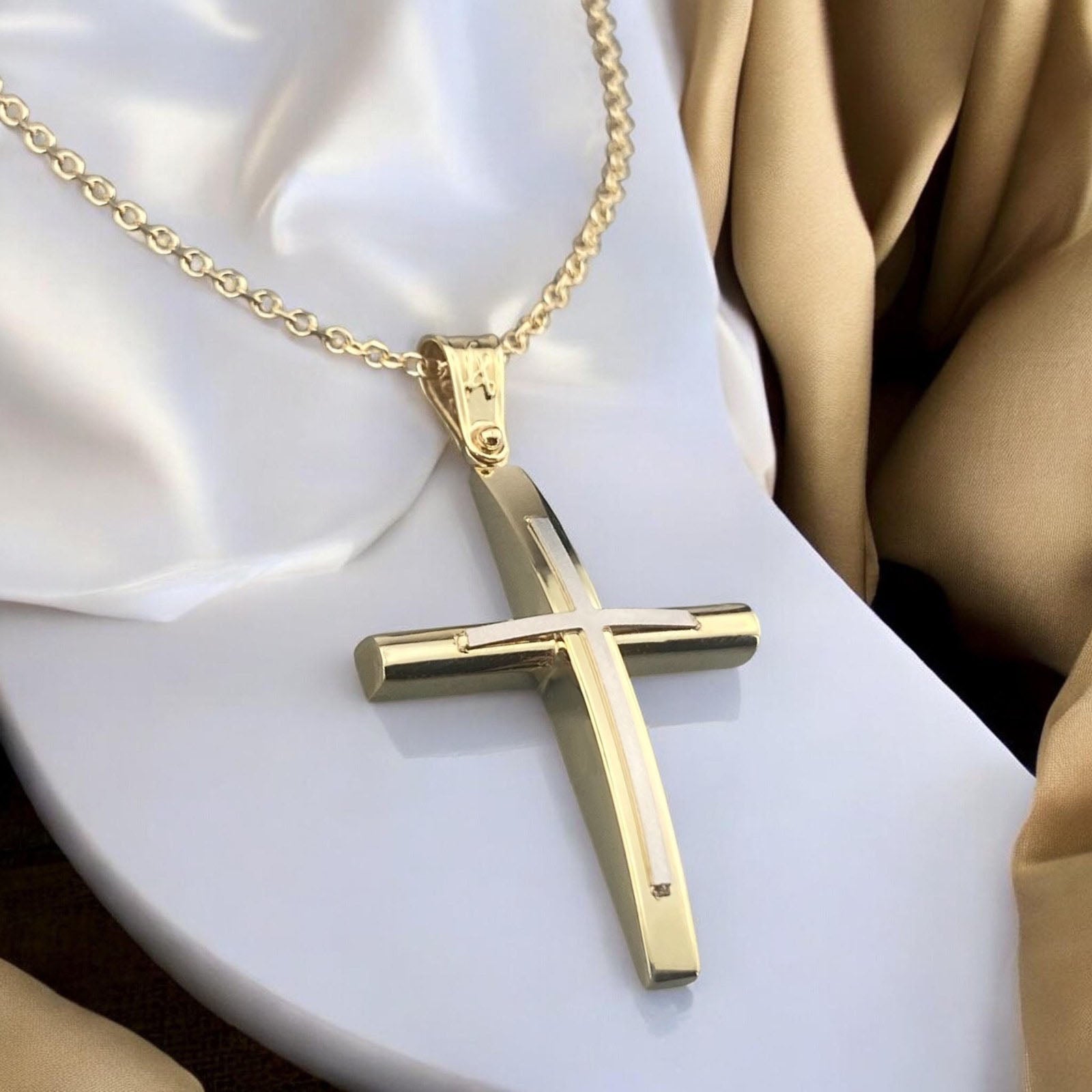 A 14K yellow gold men's cross pendant featuring a prominent white gold cross inlay centered on the design.