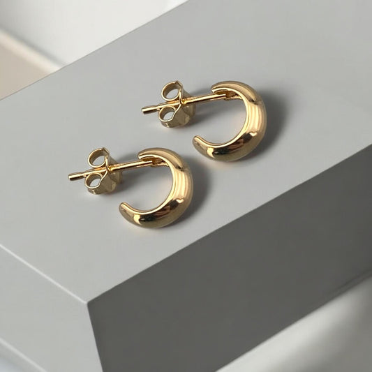 Minimalist 14k yellow gold small half-hoop stud earrings with a polished finish and secure post fastening.