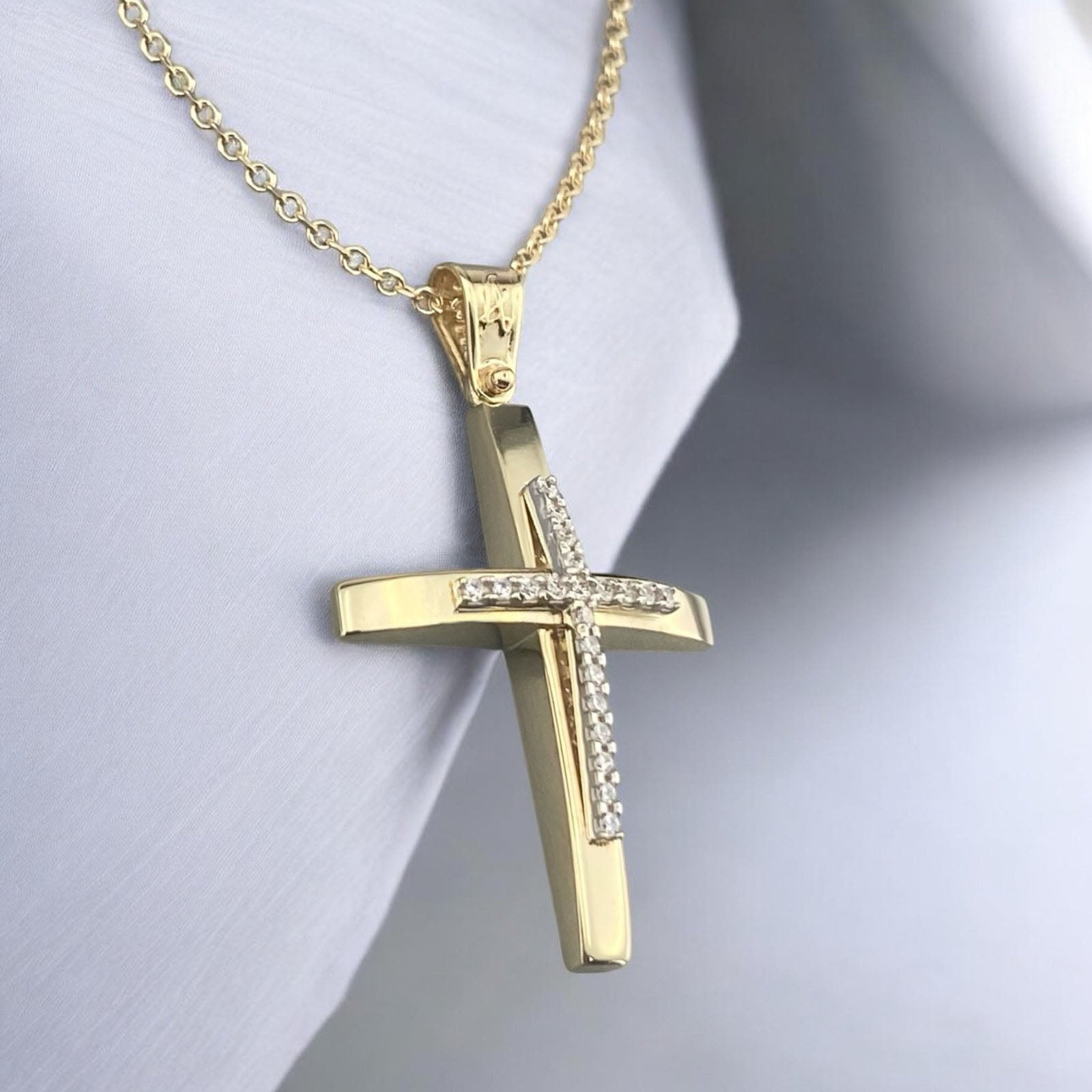 14K yellow gold cross pendant with white zirconia stones and a polished modern design