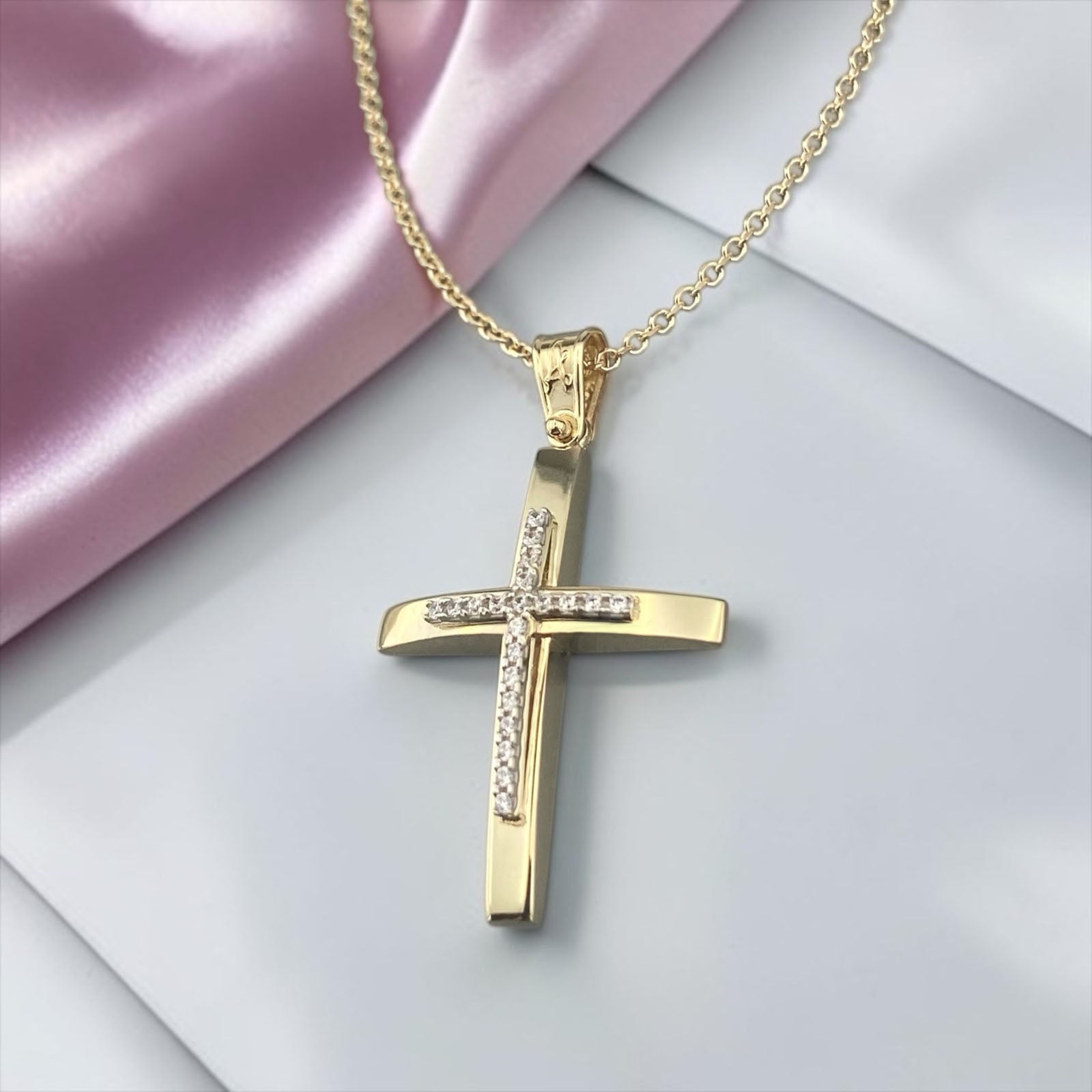 14K yellow gold cross pendant with white zirconia stones and a polished modern design