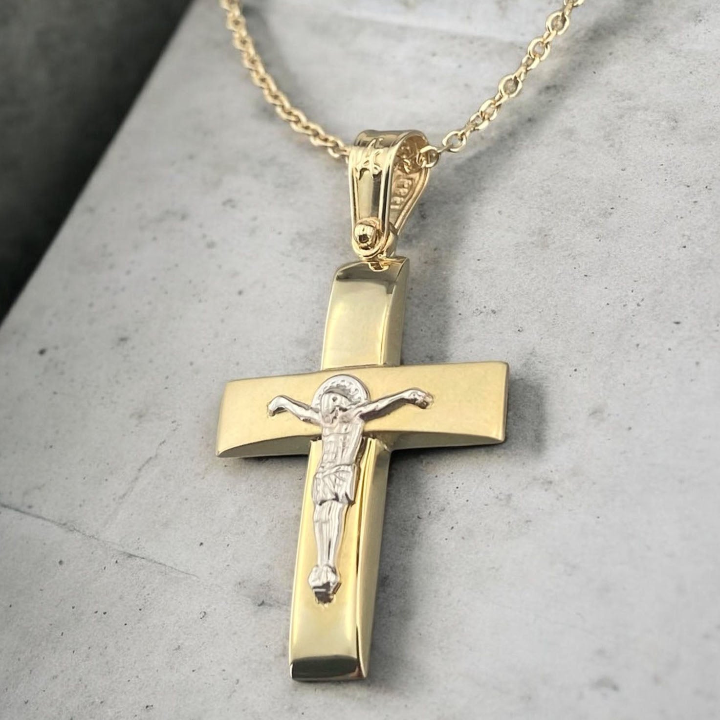 14K yellow and white gold men's cross pendant featuring a matte horizontal bar, polished vertical bar and white gold crucifix