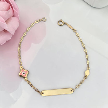 Children's 9k yellow gold ID bracelet featuring a clover-shaped pink eye charm, elegant baby jewelry.