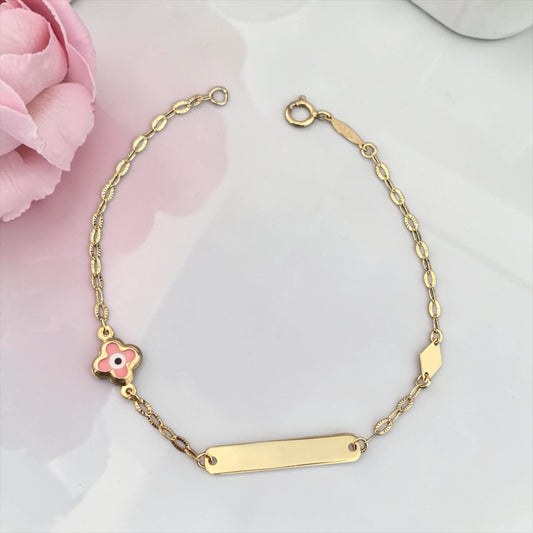 Children's 9k yellow gold ID bracelet featuring a clover-shaped pink eye charm, elegant baby jewelry.
