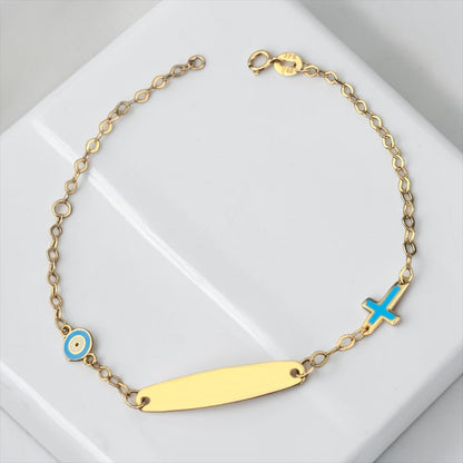 Children's 9k yellow gold ID bracelet featuring an blue eye charm and a cross charm, delicate baby jewelry.